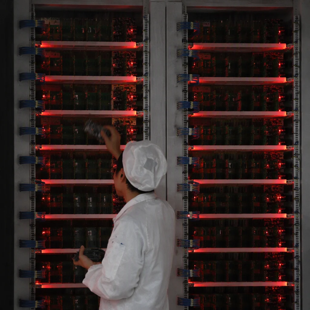Burn-in racks glowing red inside the GEOLiNK factory in Shenzhen